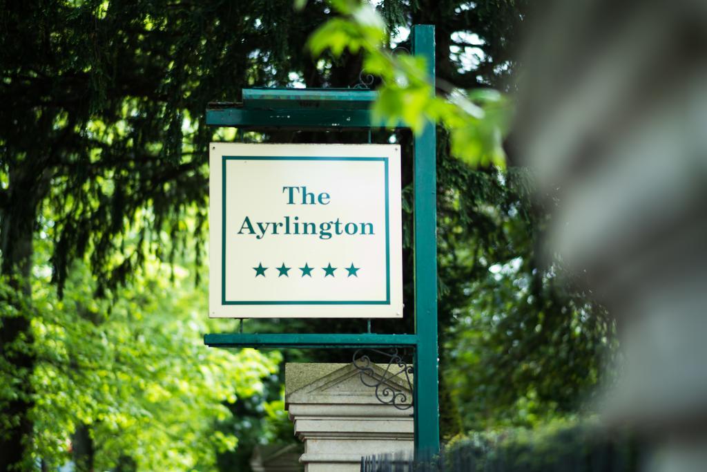 The Ayrlington Guesthouse Bath Bagian luar foto The sign at the entrance to the hotel